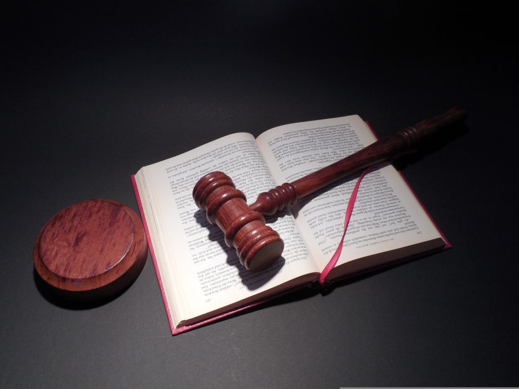A book and gavel/hammer